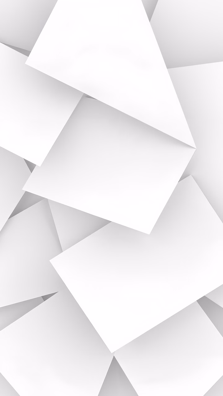 Abstract geometric shapes in soft white and gray tones create a minimalist and serene visual experience.