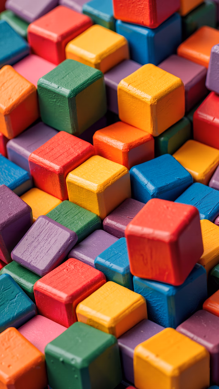 Brightly colored wooden cubes creating a chaotic yet visually appealing pattern.