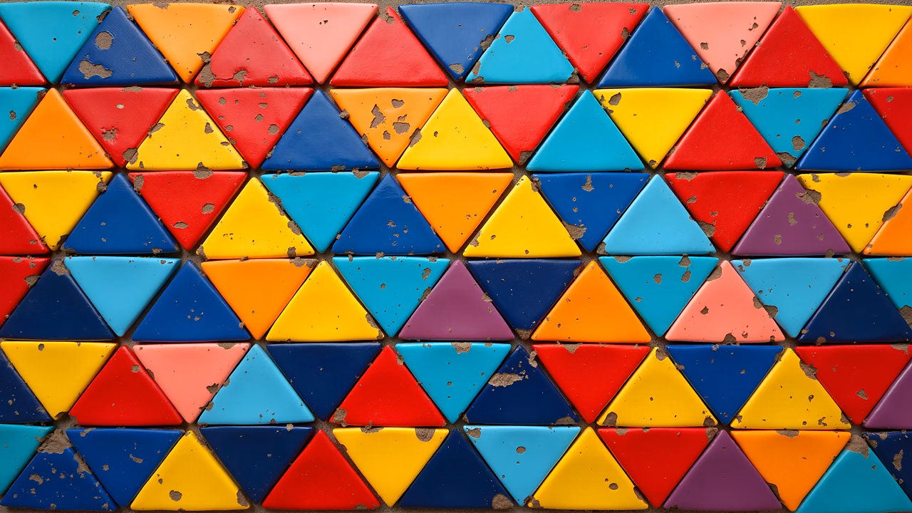 Vibrant mosaic of colorful triangles in a symmetrical grid pattern.