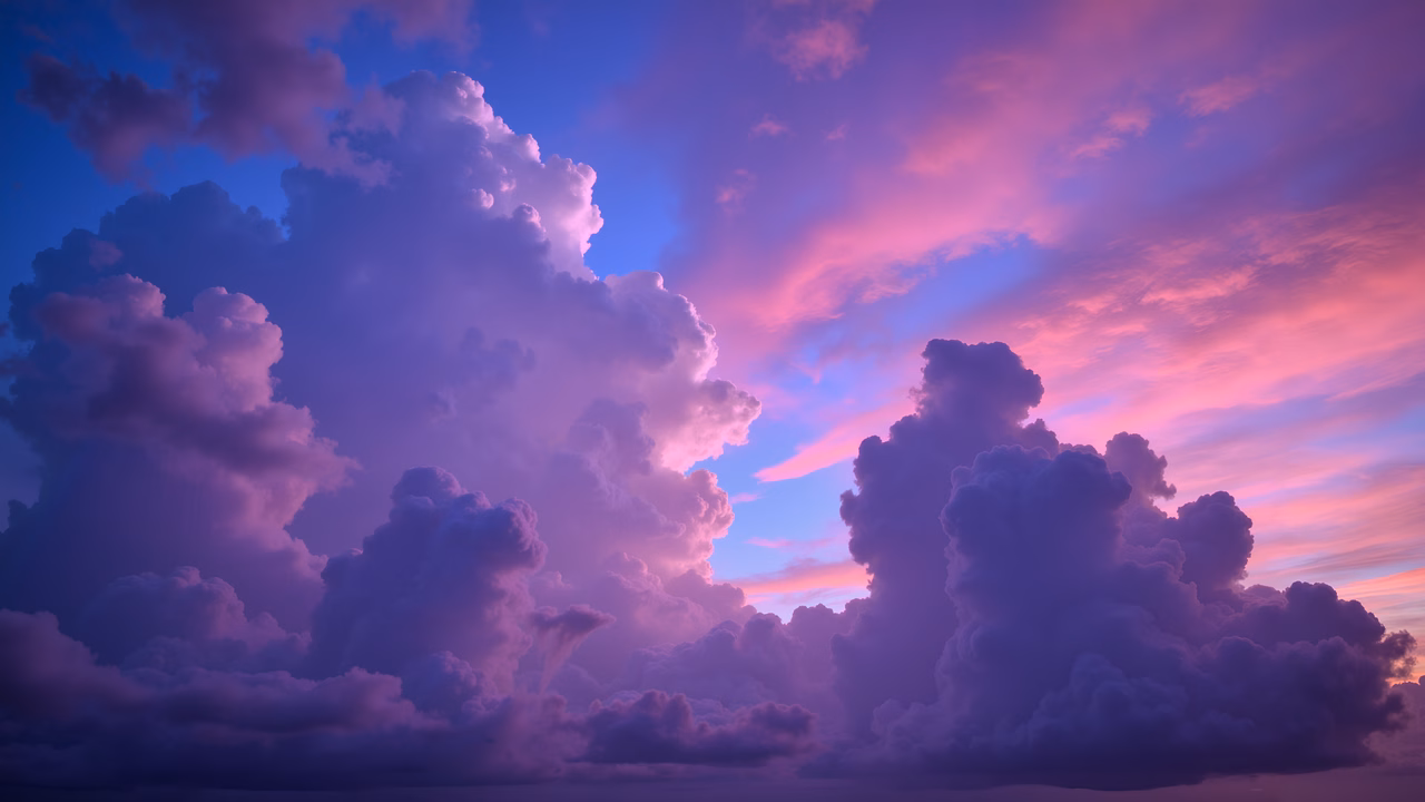Vibrant purple sky with fluffy clouds, serene and dreamy atmosphere.
