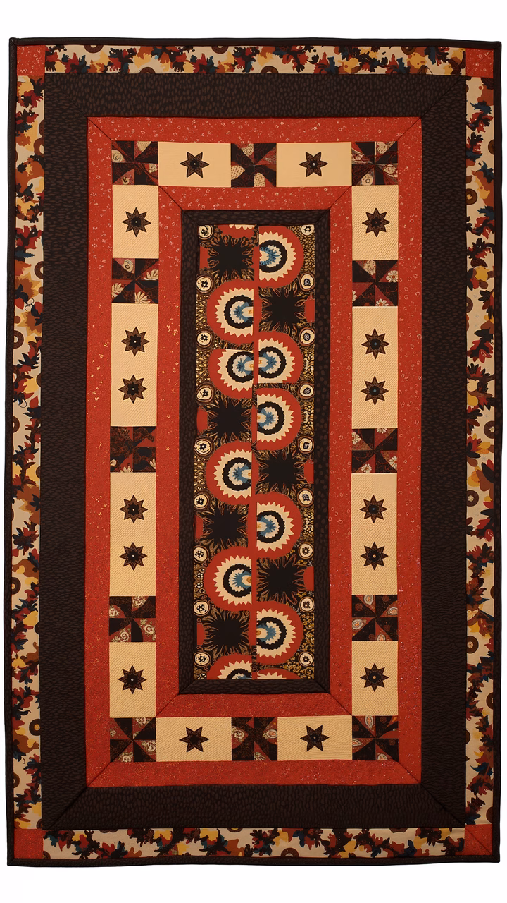 A beautifully crafted quilted panel with intricate circular designs and floral borders in warm autumn colors.