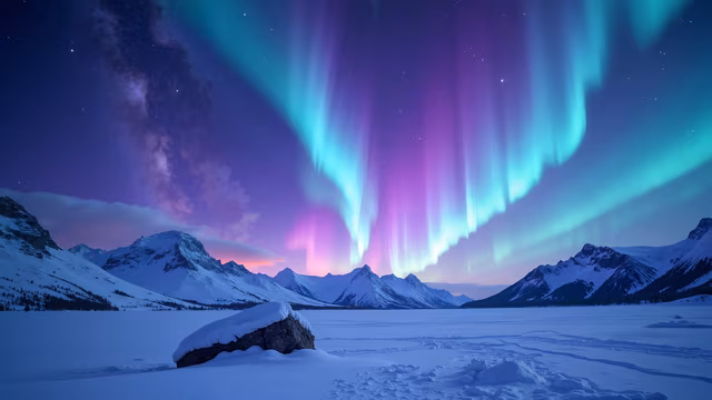 Aurora Borealis Over Snowy Mountains