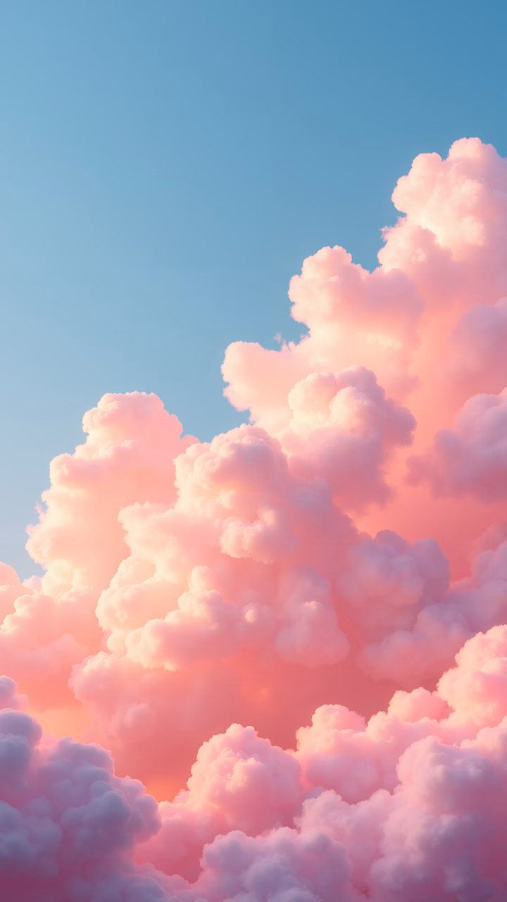 Soft pastel pink clouds in a tranquil sky, perfect for a calming background.