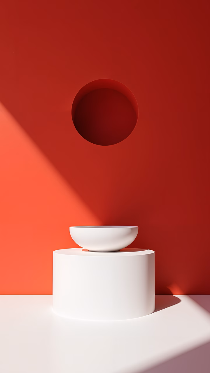 Elegant white bowl on a pedestal against a bold red background, minimalist design, sophisticated look.