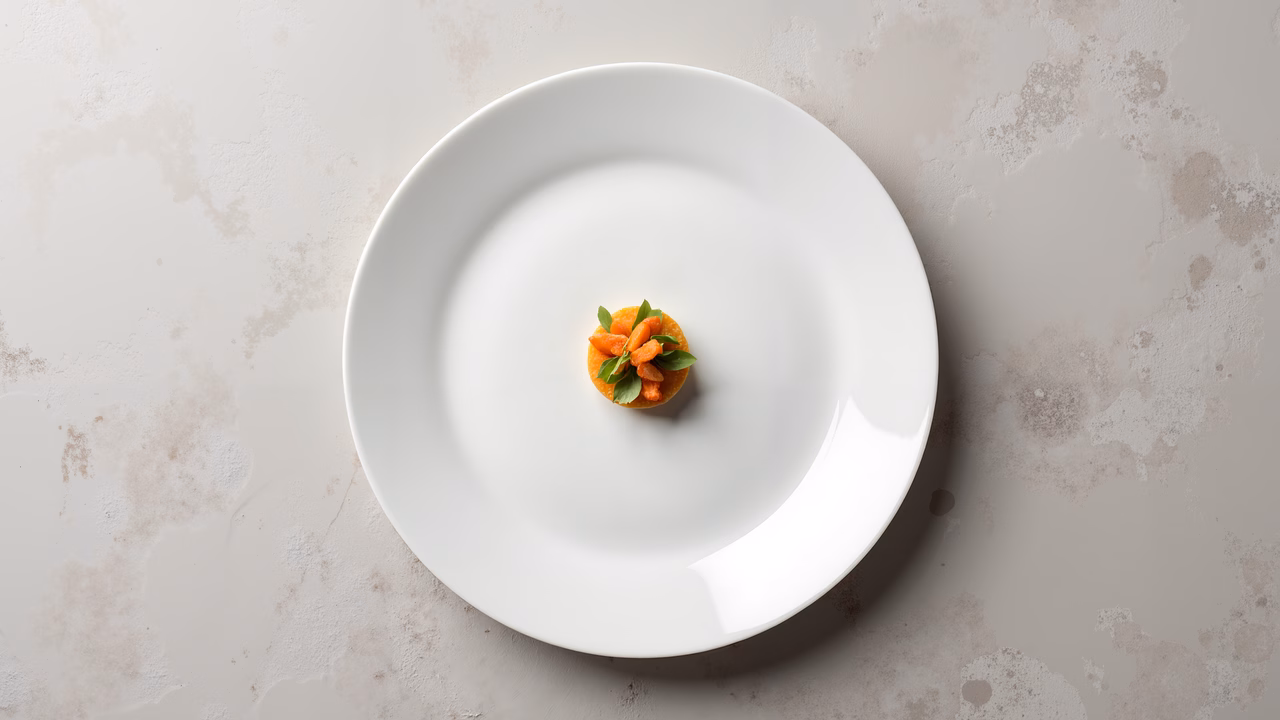 Minimalist food photography featuring a delicate dish on a white plate.