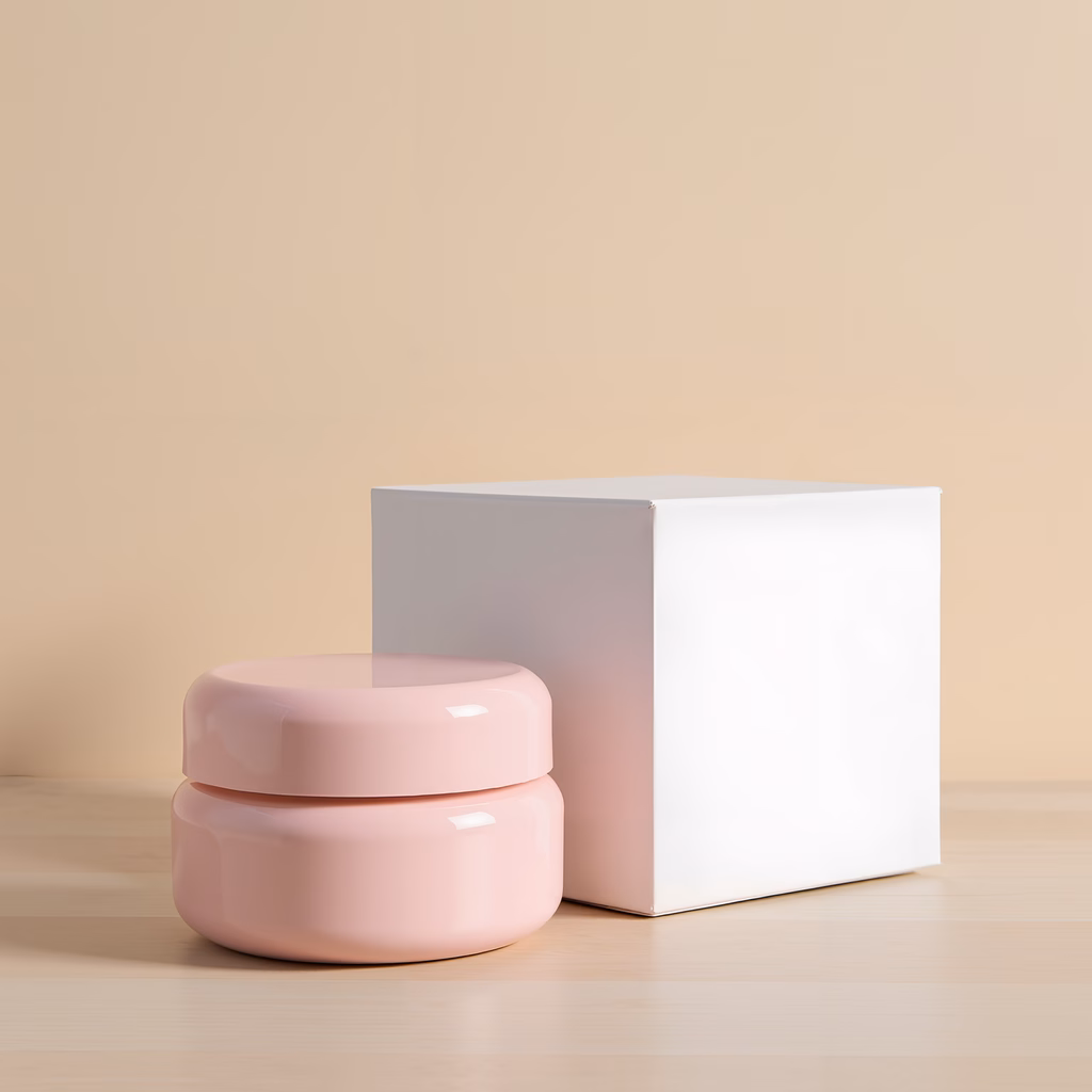 Minimalist pink containers on a light wooden surface, evoking simplicity and sophistication.