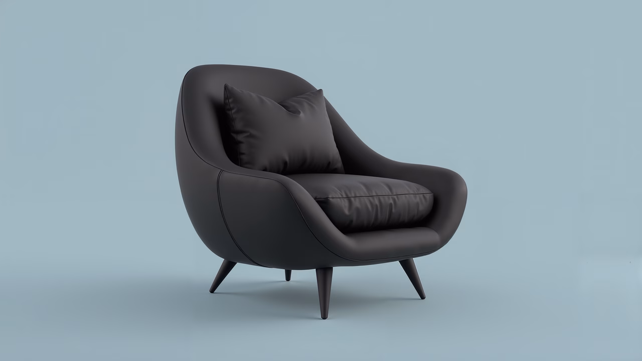 Minimalist black armchair with glossy finish and cushioned seat, set against a light blue backdrop.