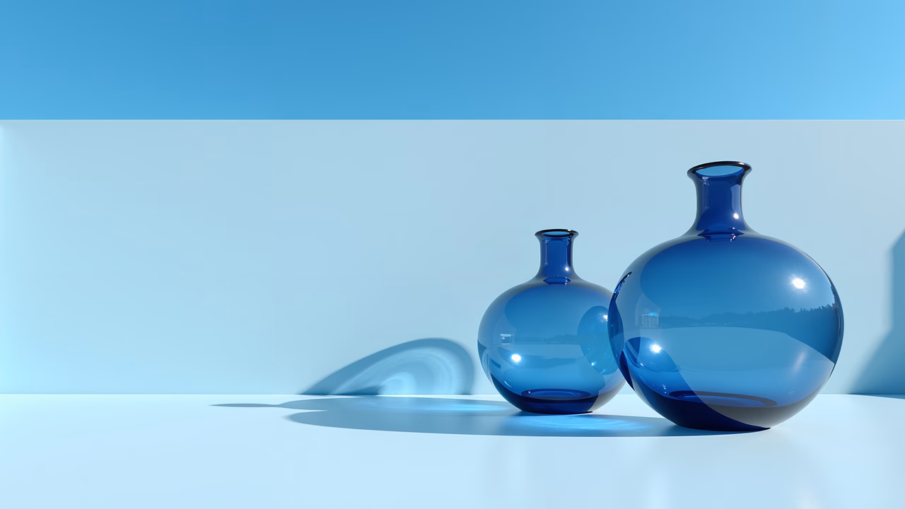 Minimalist still life featuring two blue glass bottles casting long shadows.