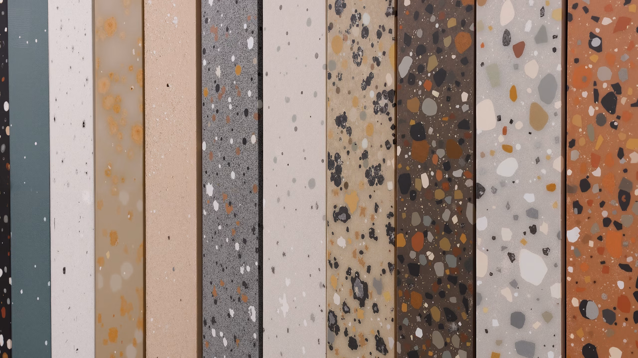 A collection of terrazzo tiles with diverse patterns and colors.