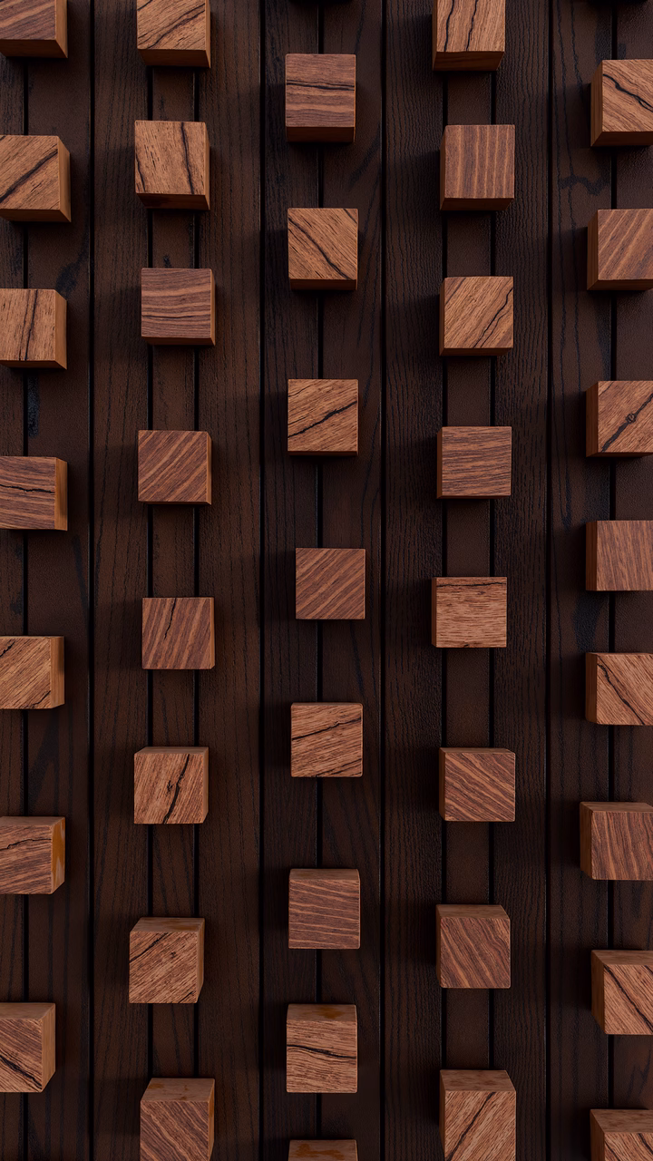 Minimalist wooden block arrangement on a dark wood background.