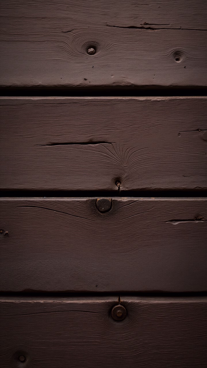 Close-up of wooden planks with natural grain patterns and knots, evoking a rustic charm.