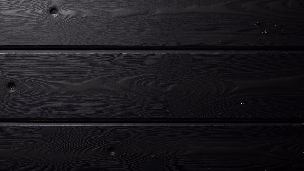 Monochrome wood texture with intricate grain patterns and knots.