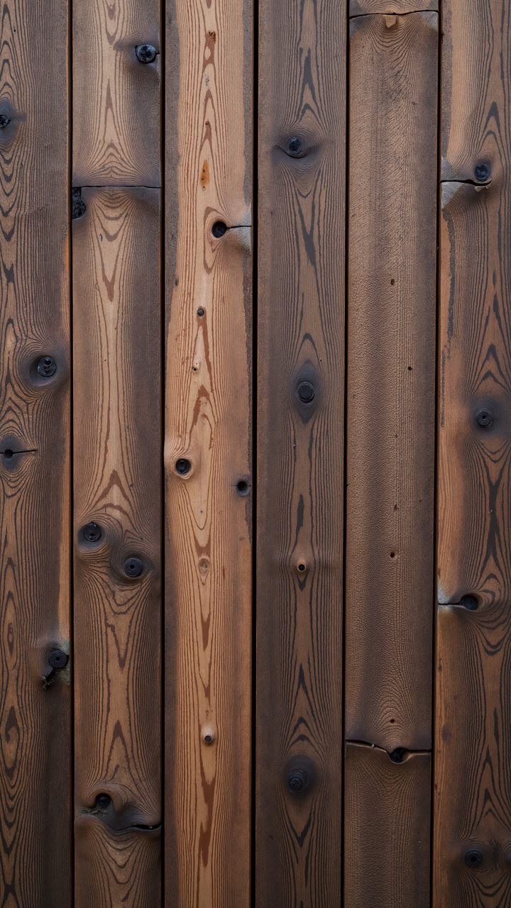 Close-up of wooden planks with natural grain patterns and knots.
