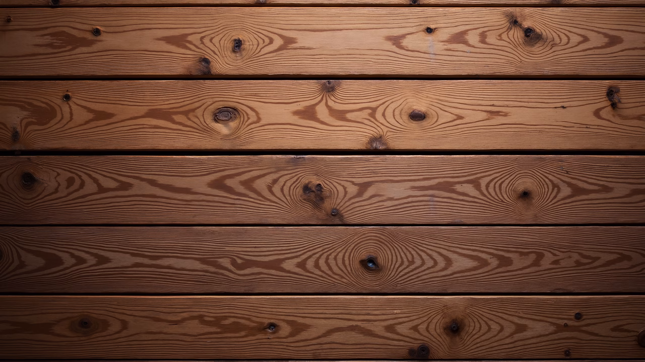 Horizontal wooden planks with natural grain patterns and knots, creating a rustic aesthetic.