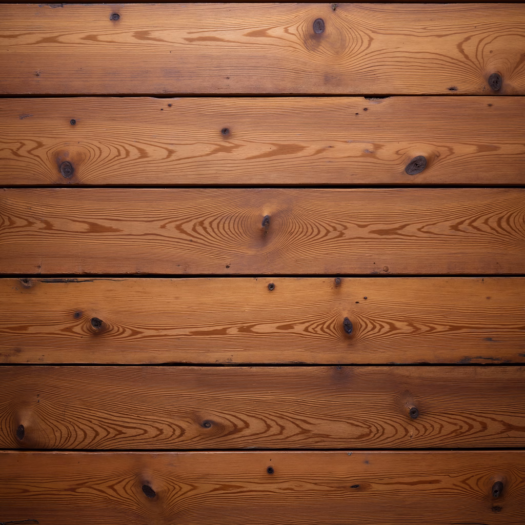 Close-up of horizontal wooden planks with warm tones and natural grain patterns.
