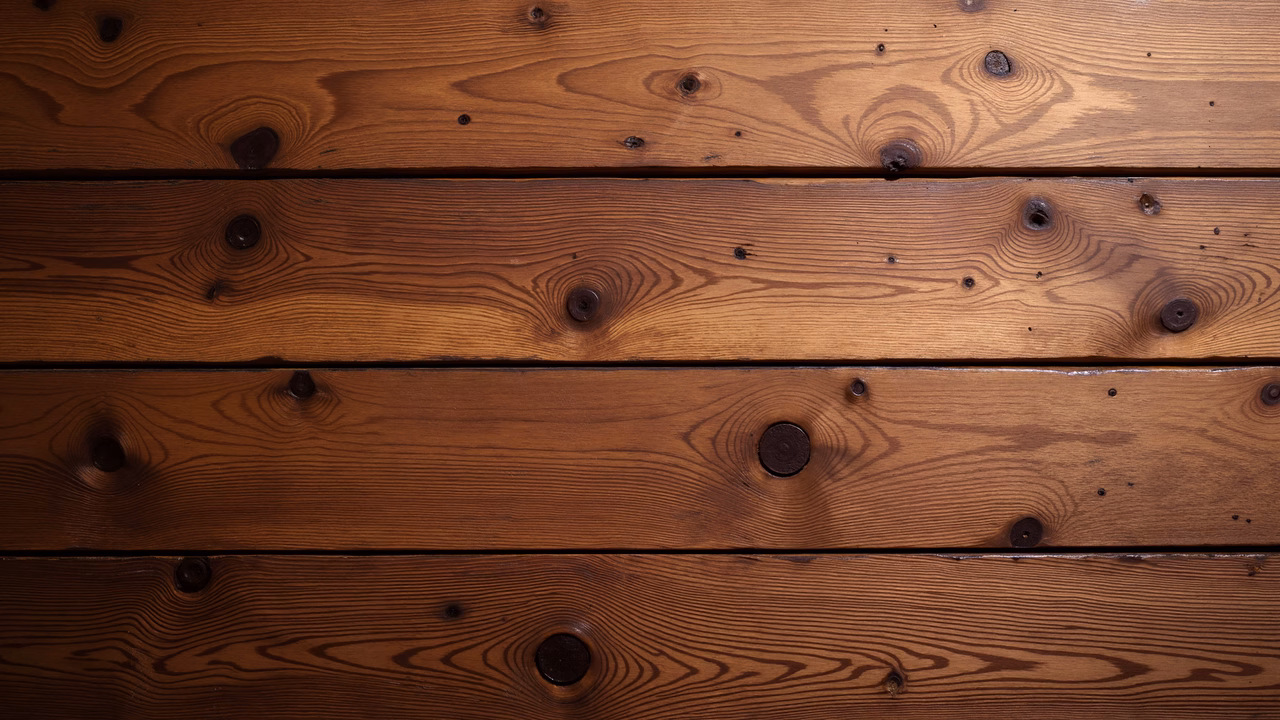 Close-up of wooden planks with rich brown tones and natural textures.