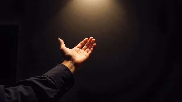 Hand Reaching for Light
