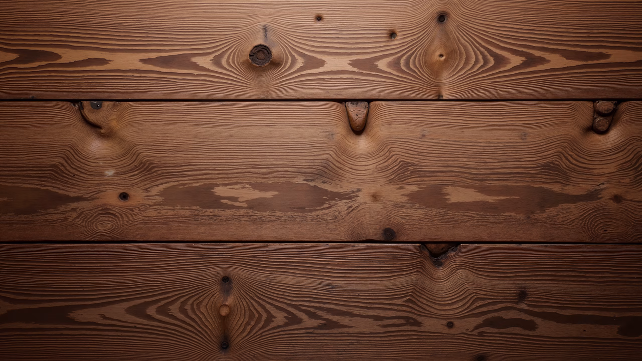 Detailed close-up of wooden planks with natural grain patterns and knots, evoking a rustic charm.