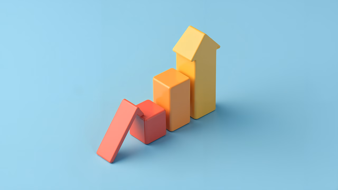 Minimalist geometric shapes in bright colors on a soft blue background.