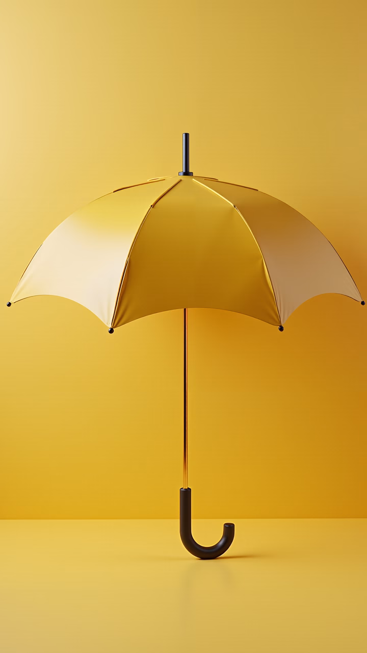 Elegant golden umbrella on a gradient yellow background, showcasing luxury and sophistication.