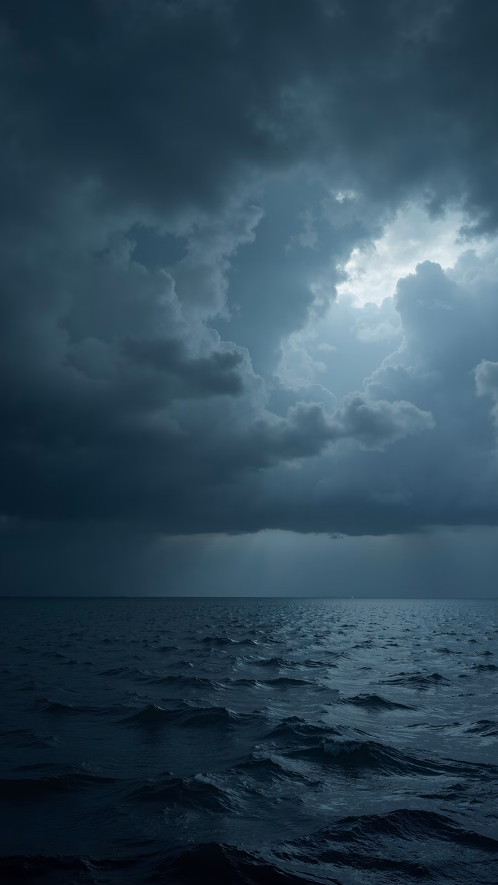 Dramatic seascape with stormy clouds and breaking sunlight.