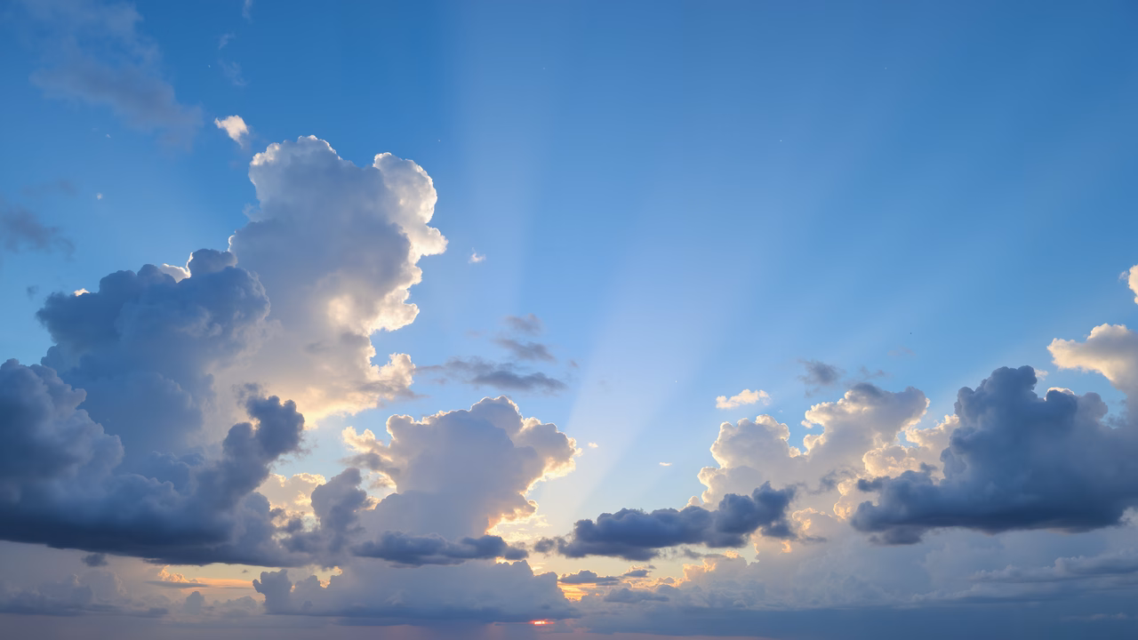 Sunlit cloudscape with dramatic lighting and vibrant colors