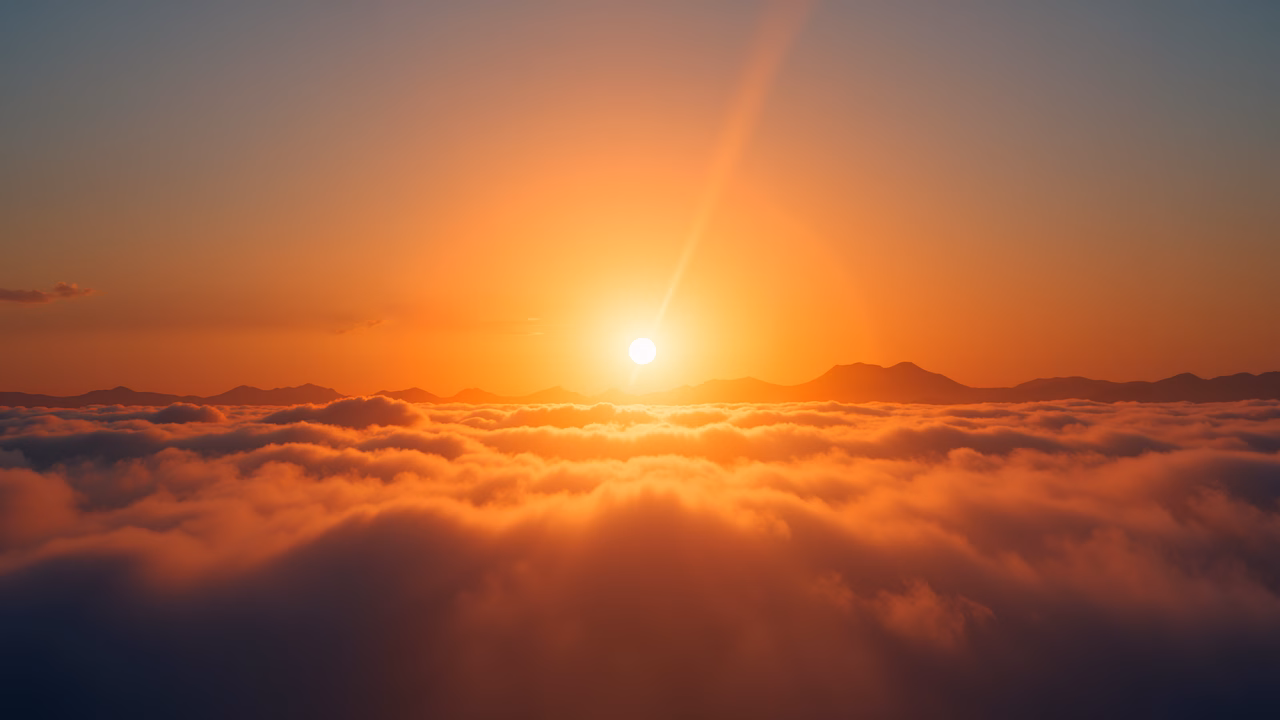 A stunning sunrise above a cloud-filled sky, capturing the serene beauty of nature.