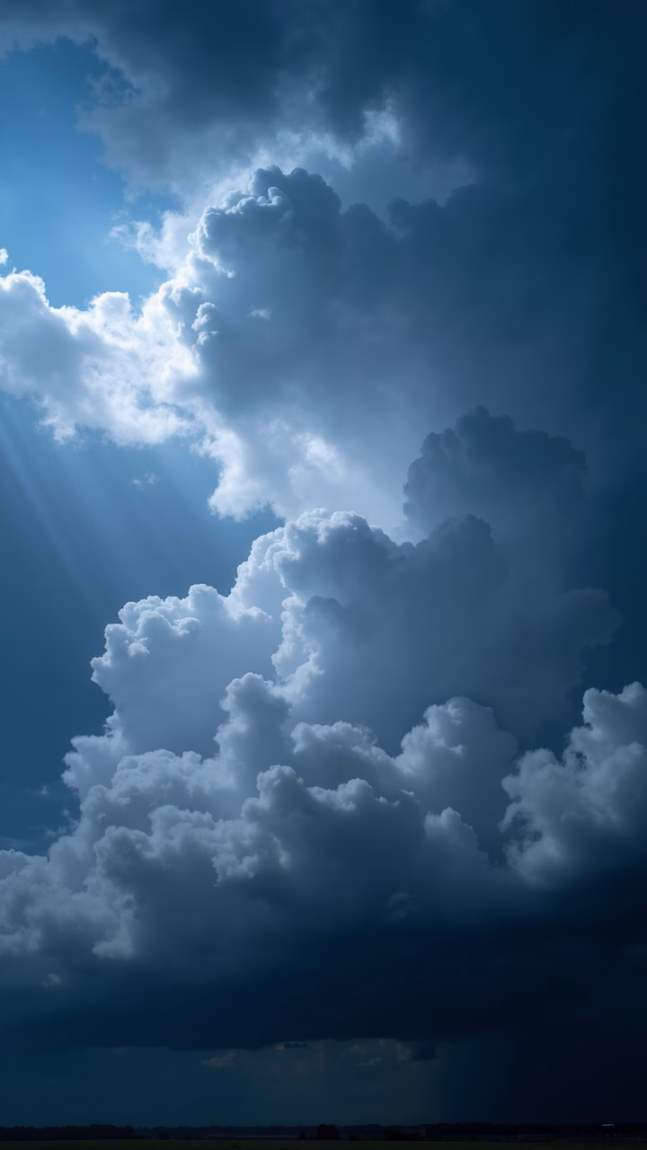Sunlit clouds over a serene sky