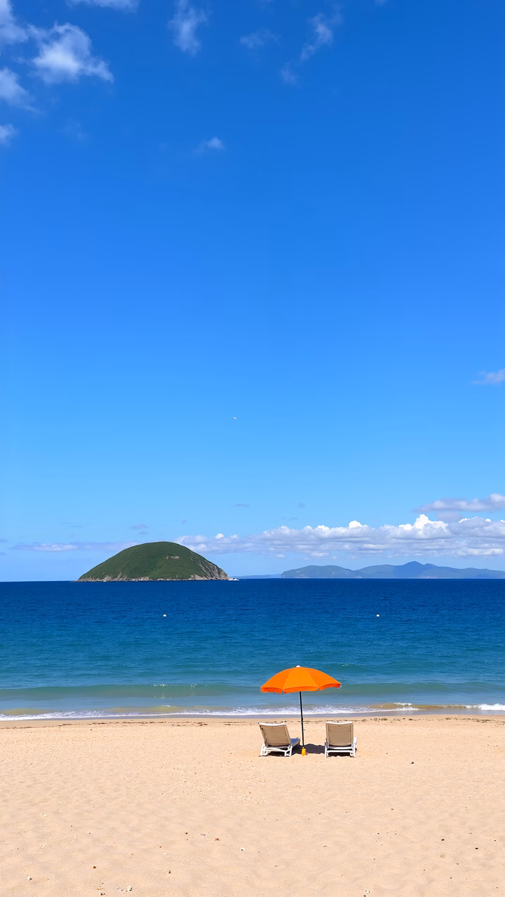 Relaxing beach scene with chairs and umbrella by the sea.