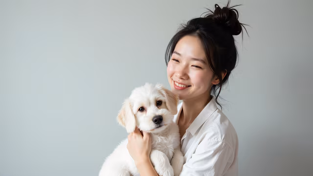 Woman Holding a Puppy
