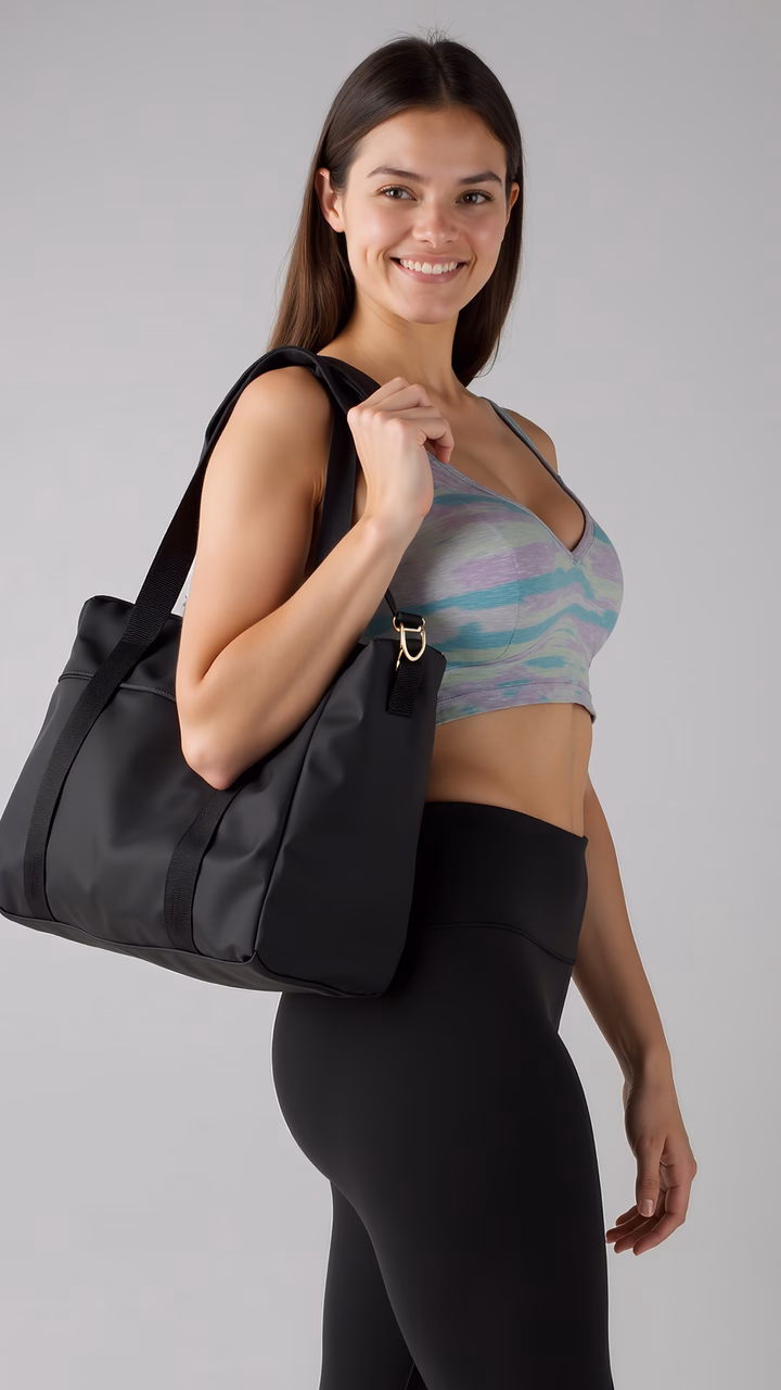 Confident fitness-ready woman with a stylish gym bag.